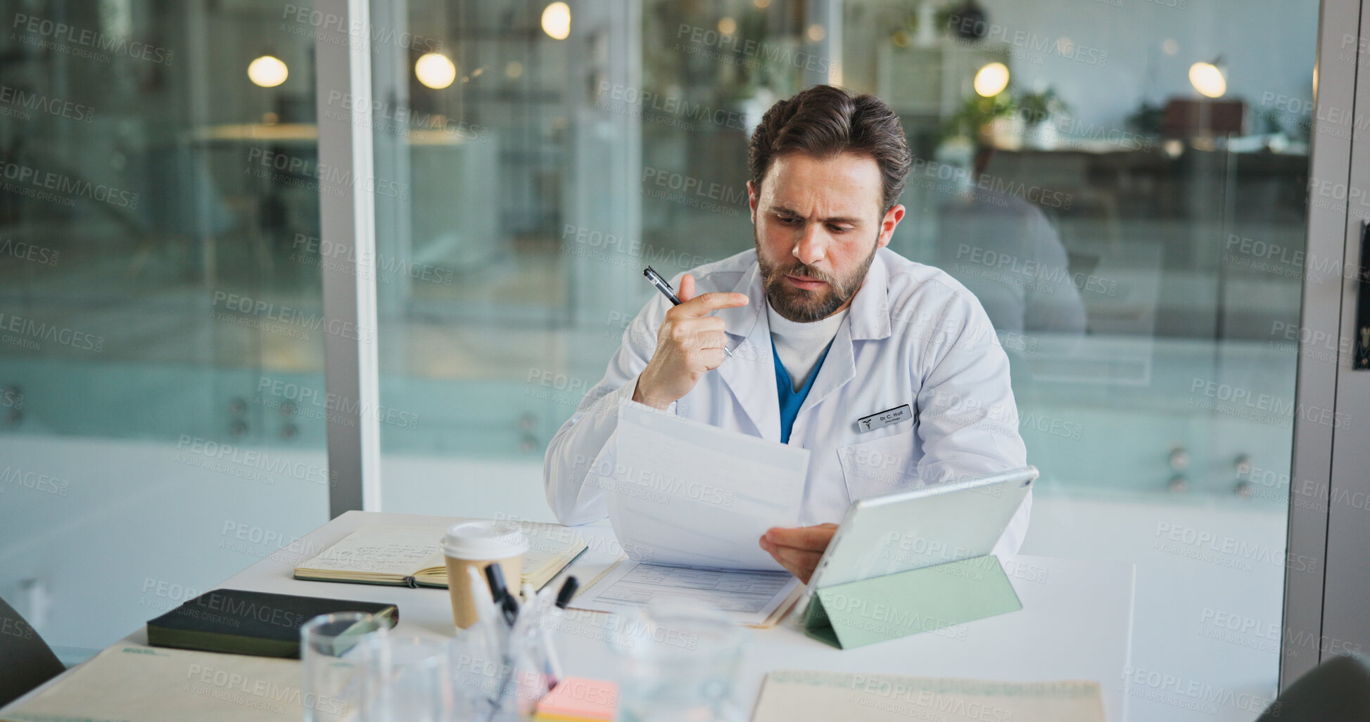 Buy stock photo Reading, doctor and documents with man in office for medical case review, treatment plan or research. Patient history, healthcare result and surgery schedule with person in hospital for clinic report