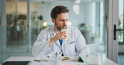 Buy stock photo Man, doctor and tablet with coffee at hospital, office and review with medical report, notification or telehealth. Person, healthcare and tech for virtual consultation, drink or application at clinic