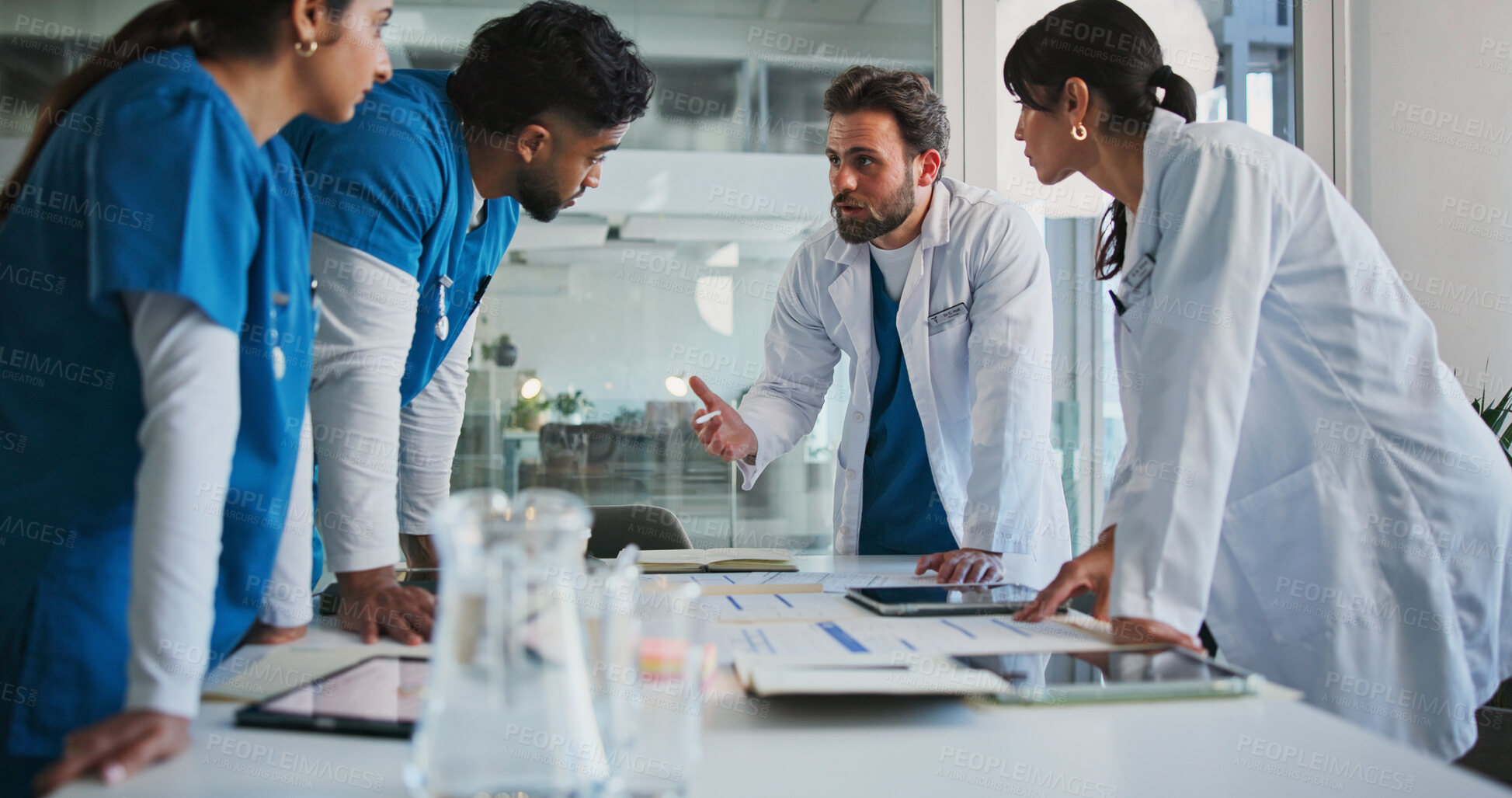 Buy stock photo Hospital, talking and doctors in meeting with paperwork for patient results, medical report and planning. Healthcare, team and people with documents for consulting, discussion and surgery schedule