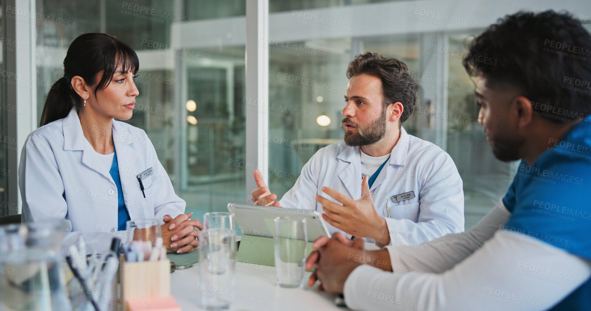 Buy stock photo Meeting, team and tablet with doctors in office for medical case review, treatment plan or research. Patient history, online healthcare result and collaboration with people talking for clinic report