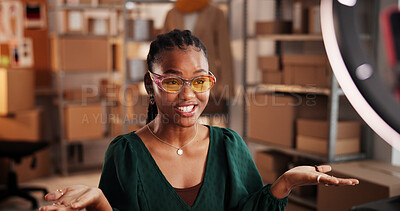 Buy stock photo Sunglasses, live stream and advertising with black woman in warehouse for startup promotion and ecommerce. Content creation, online shopping broadcast and influencer with person and accessory