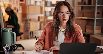 Buy stock photo Supply chain, startup and woman on laptop with notebook for planning, inventory and checklist. Office, fashion business and person on computer for research, ecommerce and shipping for customer order