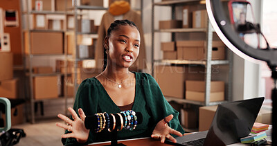 Buy stock photo Entrepreneur, vlog and woman with jewelry, warehouse and product promotion on social media or online. Influencer marketing, web and black person with smartphone for video, ring light and ecommerce