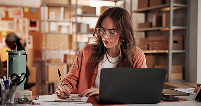 Buy stock photo Logistics, startup and woman on laptop with notebook for planning, inventory and checklist. Supply chain, retail business and person on computer for research, ecommerce or shipping for customer order