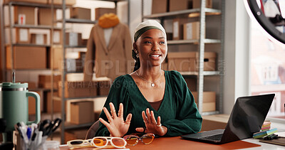 Buy stock photo Sunglasses, live stream and promotion with black woman in warehouse for startup, ecommerce and ring light. Content creation, online shopping broadcast and influencer with person and accessory