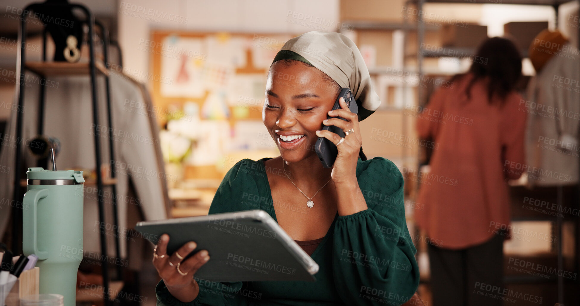 Buy stock photo Woman, designer and phone call with tablet at workshop, fashion or dropshipping order at startup. Person, smartphone and tech for talk, application and happy with feedback with clothes sale at studio