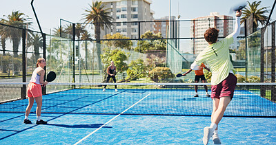 Buy stock photo Fitness, padel and people jump on court for exercise, training and practice for competition. Tennis, sports team and man and woman with racket for playing game, match and tournament for challenge