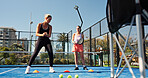 Woman, coach and training cone at tennis court with movement, coordination and advice for fitness. Person, mentor and talk with exercise drill, equipment and development for padel game at sports club