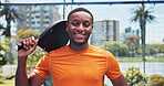 Black man, smile and portrait at tennis court for padel, fitness and outdoor training at urban park. Person, happy and pride with confidence, racket and excited for exercise at sports club in Kenya