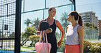 Padel, women or friends on court with discussion for sports game, friendly match and competition practice. Active, people outdoor and talking with workout for tennis fitness, tournament and training.
