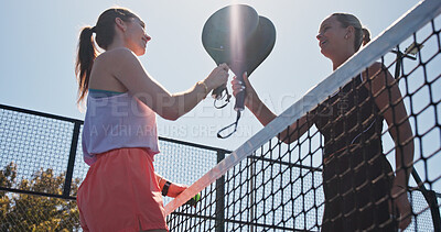 Buy stock photo Exercise, high five and padel with women on court together for practice or training from below. Fitness, sports or tennis with coach and player talking outdoor for celebration, motivation or success