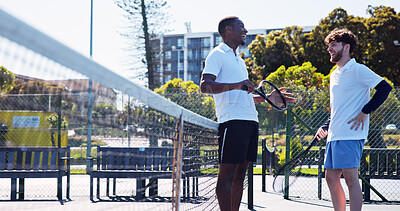 Buy stock photo Fitness, friends and laughing outdoor with tennis racket for funny story, match and competition practice. Low angle, people and athletes on court with equipment for game plan, sports joke and advice.