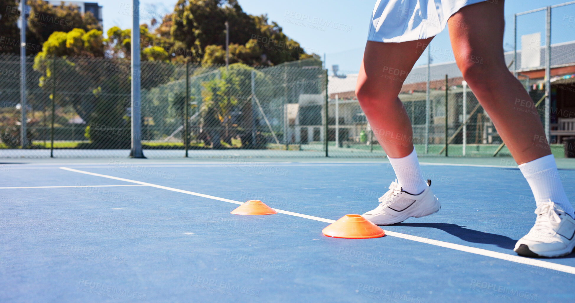 Buy stock photo Tennis court, fitness and legs with cone for training, agile practice and sports drill for workout. Coordination exercise, speed development and woman with footwork performance, outdoor and equipment