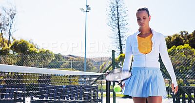 Buy stock photo Exercise, serious and walking with woman on tennis court for start of game, match or practice. Competition, fitness and preparation with athlete person outdoor for health, sports or training session