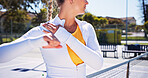 Tennis court, stretching shoulder and woman for fitness, training and practice for game. Sports, athlete and person with warm up for workout, hobby and exercise for match, tournament and challenge