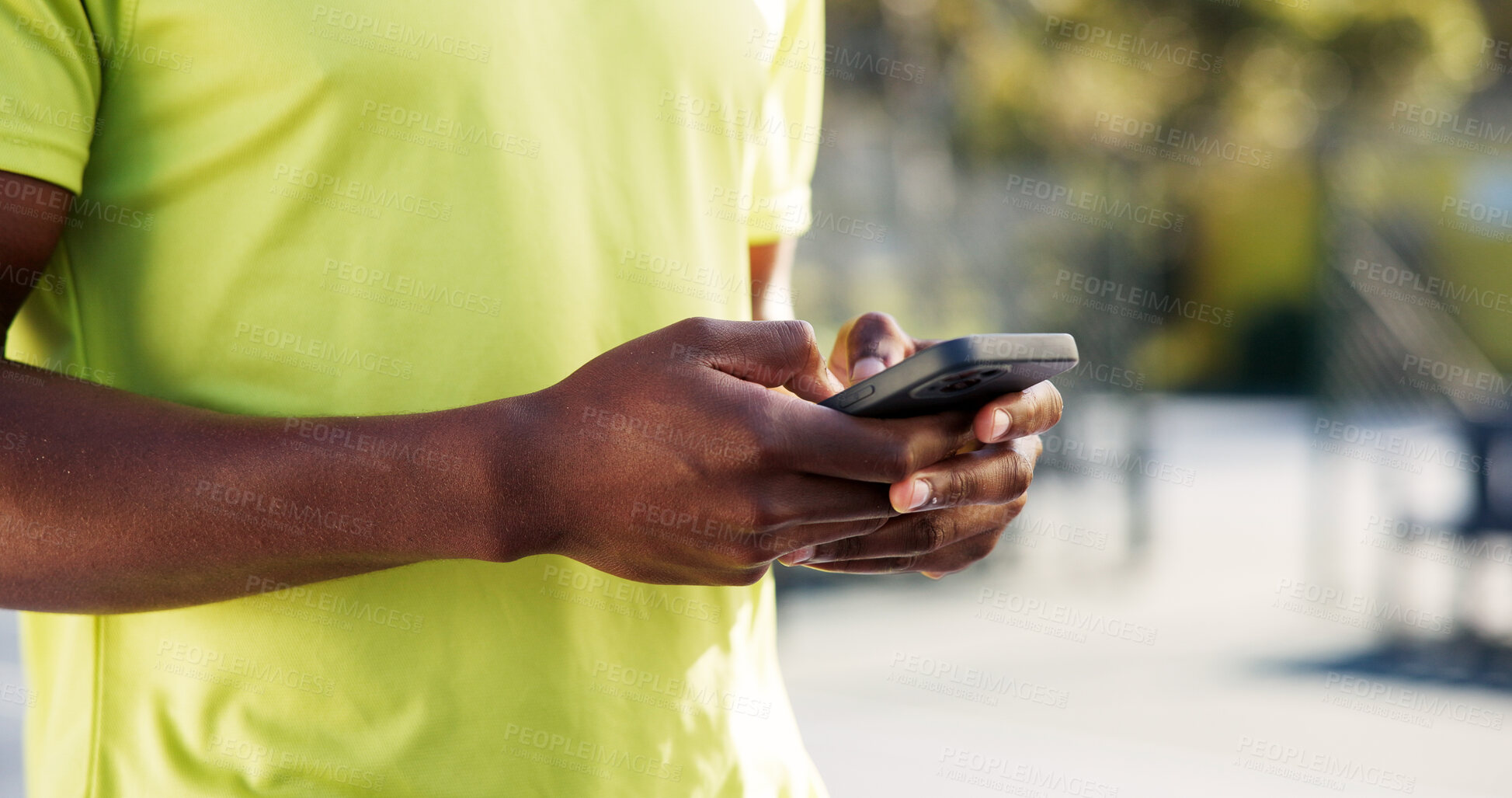 Buy stock photo Fitness, phone and hands on court with typing, message update or exercise post on social media. Digital, man or athlete outdoor with mobile, wellness chat or virtual tutorial on training break