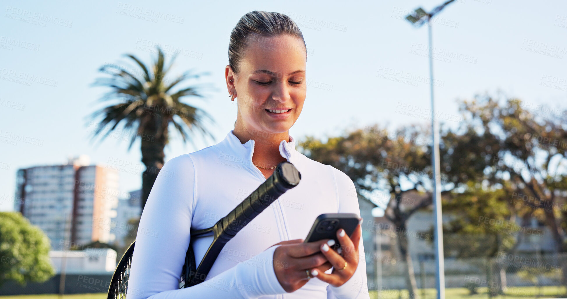 Buy stock photo Smile, woman and reading with phone on tennis court for fitness, training app and match progress. Happy, female person and mobile with racket for sports, video demonstration and online tips for game