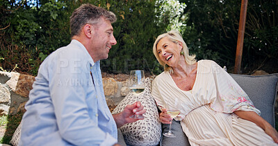 Buy stock photo Mature couple, wine and happy outdoor on couch, patio and laugh with funny memory in summer. People, relax and smile with drinks, alcohol or bonding for chat on sofa, love and break in backyard