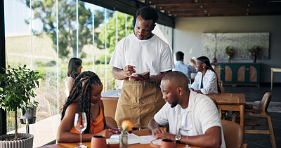 Buy stock photo Writing, order and waiter with couple, menu or customer service with notepad, choice and restaurant. Fine dining, server and person with journal for meal options, notes or info for decision in diner