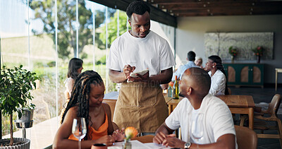 Buy stock photo Writing, order and waiter with couple, talk or customer service with notepad, choice and restaurant. Fine dining, server and person with journal for meal options, notes or info for decision in diner
