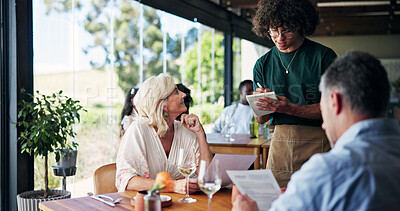 Buy stock photo Waiter, mature couple and writing with restaurant menu, meal choice and happy customer experience. Woman, men and server with notes, service and talk for food with smile on date with partner at diner