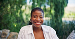 Portrait, black woman and relax with smile outdoor for travel, summer trip and holiday adventure. Happy, female person and pride at luxury retreat, explore nature and vacation destination for getaway