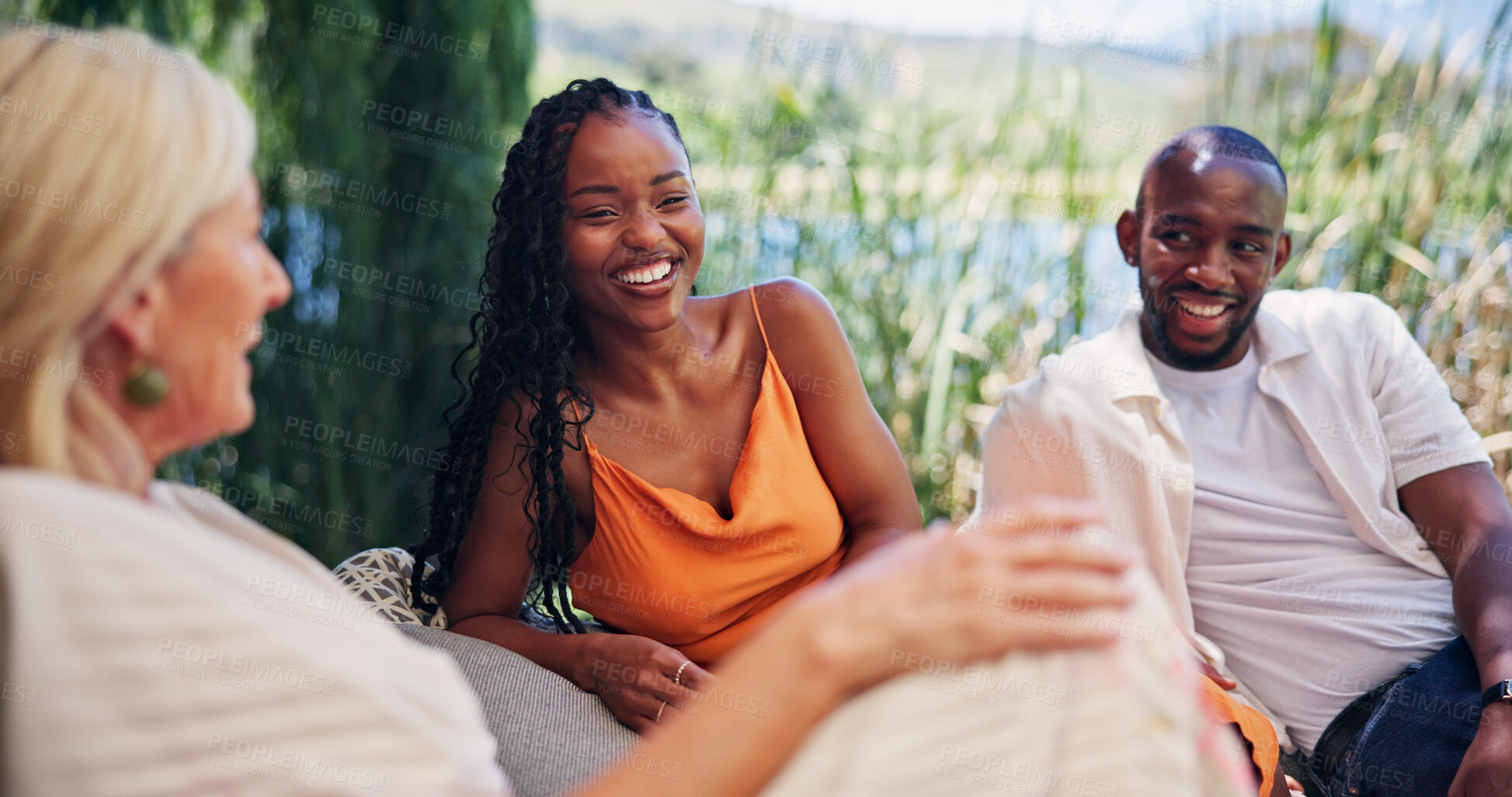 Buy stock photo Friends, laugh and relax outdoor at resort for summer holiday, social gathering and funny story. Happy people, chill and conversation in nature with humor for bonding together, connection or reunion.