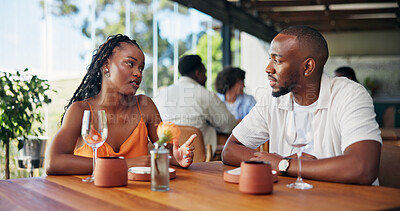 Buy stock photo Conversation, date and serious with couple in restaurant together for bonding or relationship. Break, discussion and feedback with people at table in coffee shop for connection or hospitality
