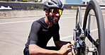Sports, repair and man with bicycle in city to check wheel, tire and gears for maintenance outdoor. Happy, fitness and person fixing bike in town for cycling, training and active hobby for exercise