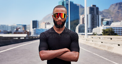 Buy stock photo Athlete, sunglasses and man with arms crossed, city and pride for fitness with sportswear on street. Outdoor, runner and black person with shades for workout routine, healthy and confident on road