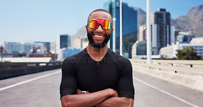 Buy stock photo Runner, sunglasses and man with arms crossed, city and confident for fitness with sportswear on road. Outdoor, athlete and black person with shades for workout routine, healthy and pride on street