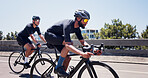 Fitness, men and cycling on bike in city for triathlon challenge, competition workout or sport. Active, people and bicycle on bridge for cardio exercise, marathon endurance and pace training for race