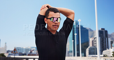 Buy stock photo Stretching, sports and man in city with sunglasses for fitness, cycling and active hobby outdoor. Athlete, town and person with polarized lens with warm up for exercise, workout or training in street