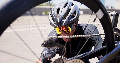 Buy stock photo Cyclist, repair and man with bicycle in city to check wheel, tire and gears for maintenance outdoor. Sports, fitness and person fixing bike in town for cycling, training and active hobby for exercise