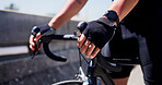 Cycling, hands and athlete on bicycle, city or practice competition on urban road, fitness or active. Outdoor, cyclist and person on bike for sport tournament, training and eco friendly transport