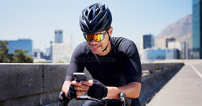Buy stock photo Man, phone and bike for fitness in city, sunglasses and smile for notification, tracking or timer on bridge. Person, happy and outdoor with smartphone, mobile app and exercise on road in urban town
