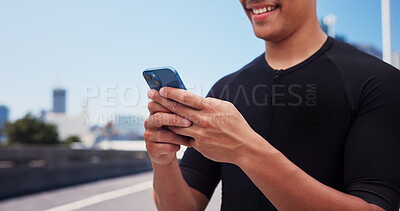 Buy stock photo Hands, runner and phone for texting in city, contact and smile with fitness, notification and tracking. Person, happy and smartphone with mobile app, monitor or space for exercise on bridge in town