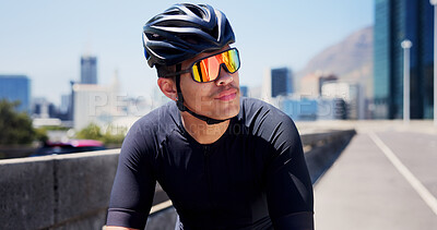 Buy stock photo Thinking, sports and man outdoor with sunglasses for fitness, cycling and active hobby in city. Athlete, helmet and person with polarized lens, thoughtful and rest for exercise, workout and training