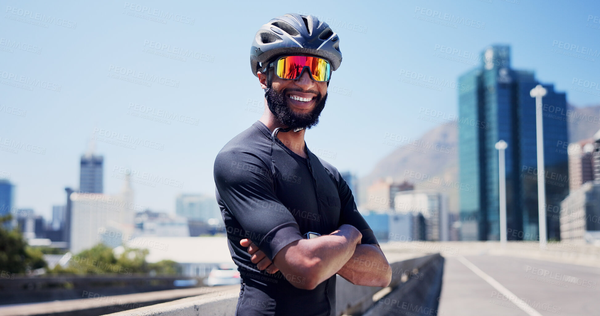 Buy stock photo Crossed arms, sports and man in city with sunglasses for fitness, cycling and active hobby outdoor. Athlete, town and person with polarized lens with confidence for exercise, workout and training