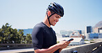 Phone, fitness and cyclist with man in city for tracking performance, workout stats and health app. Training guide, exercise checklist and tech with person and mobile outdoor for cycling route