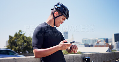 Buy stock photo Man, cyclist and phone on break in city with helmet, sky and space for fitness, smile and cardio. Person, smartphone and mobile app with bike, outdoor or happy with stopwatch with profile on bridge