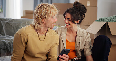 Buy stock photo Boxes, conversation and moving day with couple in apartment together for property investment. App, real estate and smile with happy people on floor in living room of new home for house relocation