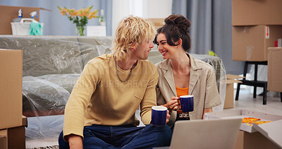 Buy stock photo Happy couple, relax and coffee with laptop in new home for renovation, moving in or fresh start. Man, woman and smile with boxes for relocation, property or investment in apartment together or house