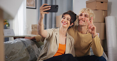 Buy stock photo Happy, couple and relax with selfie at new home for photography, social media post and moving in. Smile, people and profile picture update with peace sign, property investment and relocation memory