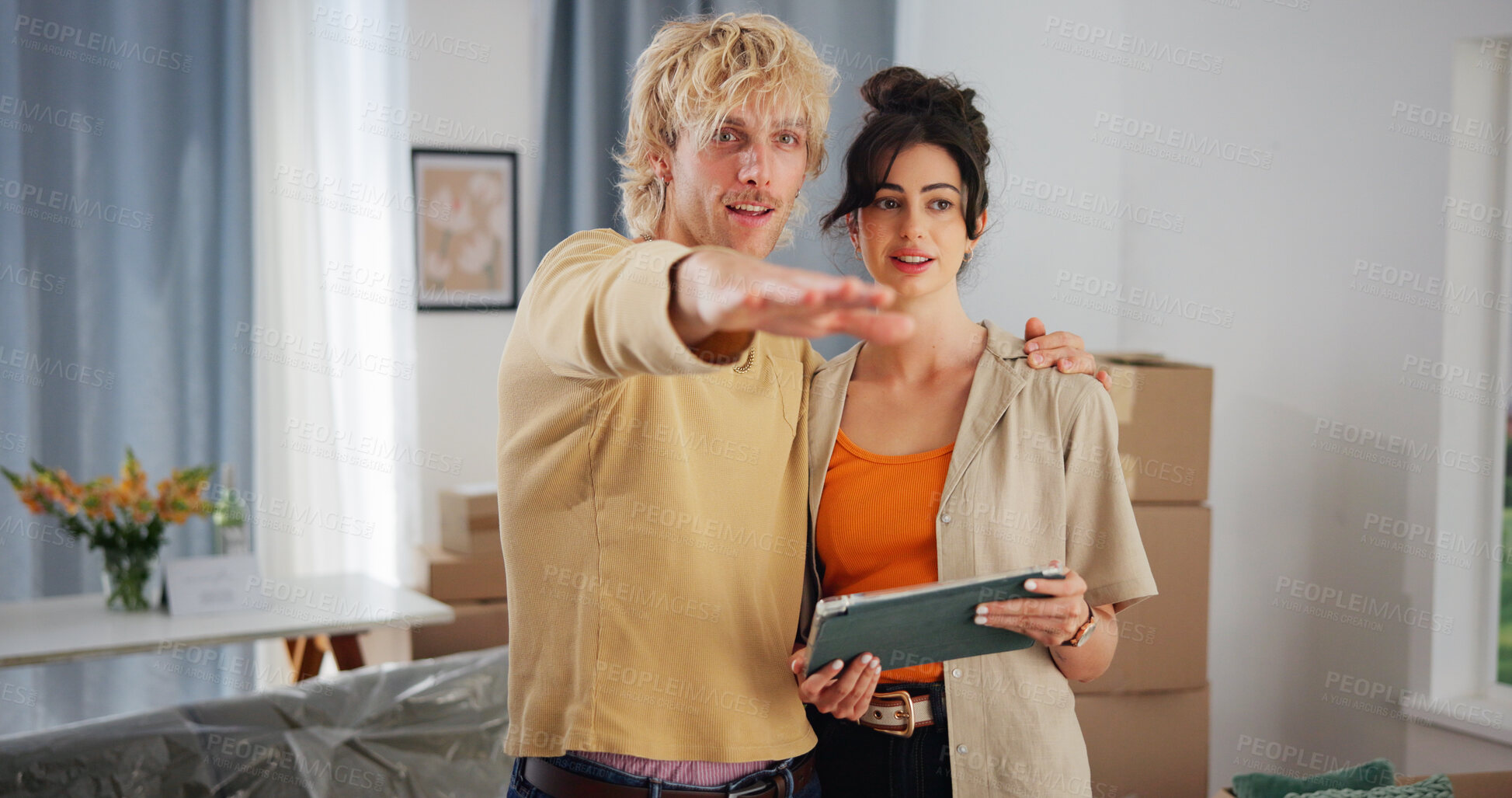 Buy stock photo Couple, tablet and discussion with boxes in new home for bonding, interior design and layout app in property. People, tech and planning in lounge for love, real estate development or renovation