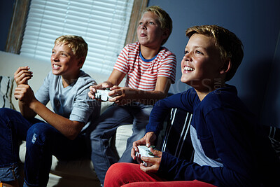 Buy stock photo Children, play and video games with controller for gaming competition, tournament and entertainment. Smile, kids and friends with console for esports practice, friendly rivalry and challenge at house