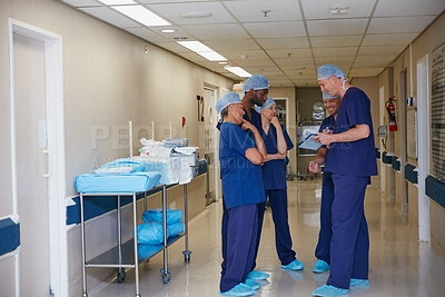 Buy stock photo Discussion, meeting and tablet with surgeon team in hospital hallway for medical consulting. App, results or update with doctor and nurse people in corridor for conversation, healthcare or strategy
