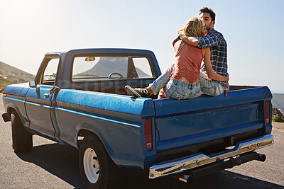 Buy stock photo Car, couple or back with kiss for road trip, holiday or outdoor vacation together on mountain. Man, woman or lovers with truck or affection in sunshine for romance, love or travel adventure in nature