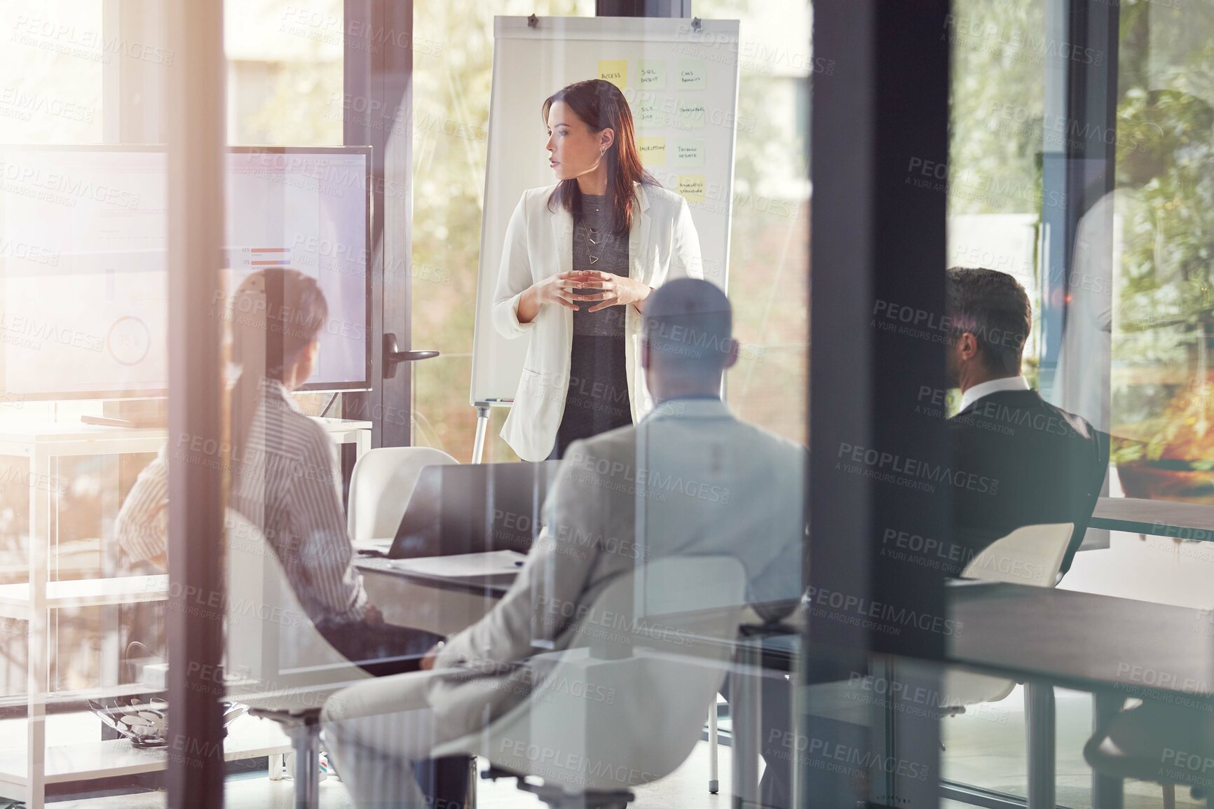 Buy stock photo Presentation, meeting and businesswoman with team in glass office with statistics for finance report. Whiteboard, discussion and group of financial advisors with charts, data or graphs for investment