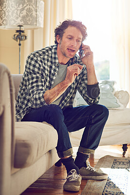 Buy stock photo Phone call, angry and talking with man on sofa in home for fraud dispute, negotiation and spam crisis. Communication, frustrated and scam mistake with person in living room of apartment for stress